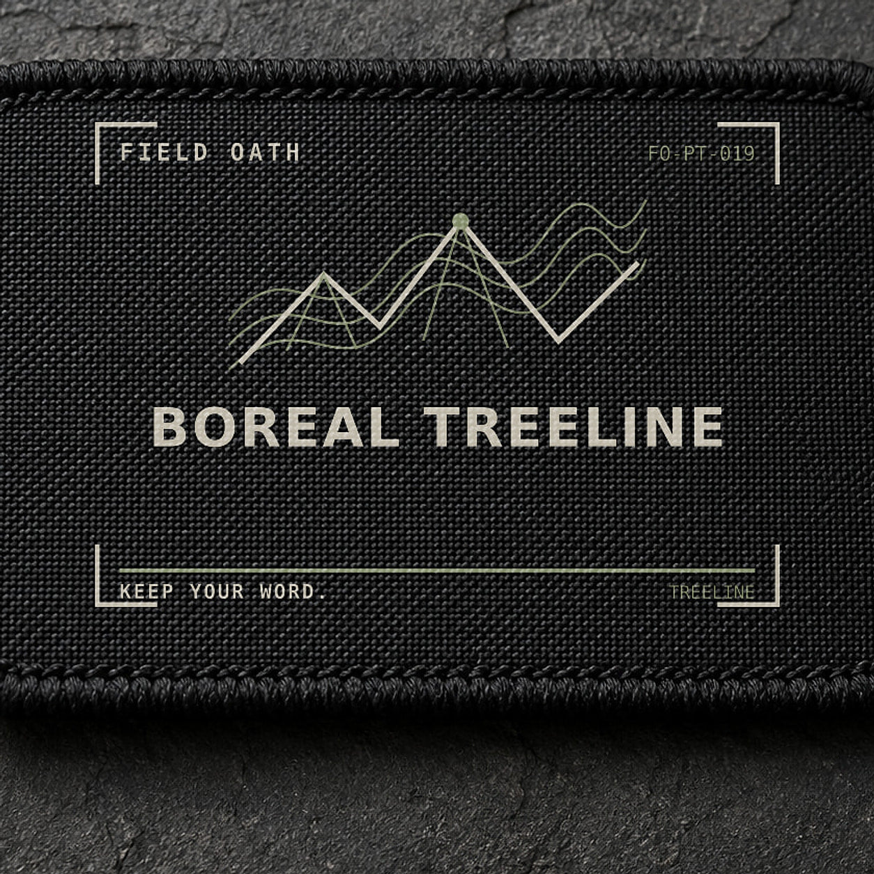 FIELD OATH Boreal Treeline Patch close-up showing woven face, stitched border and embroidery detail