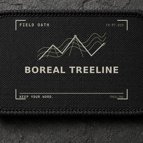 FIELD OATH Boreal Treeline Patch close-up showing woven face, stitched border and embroidery detail