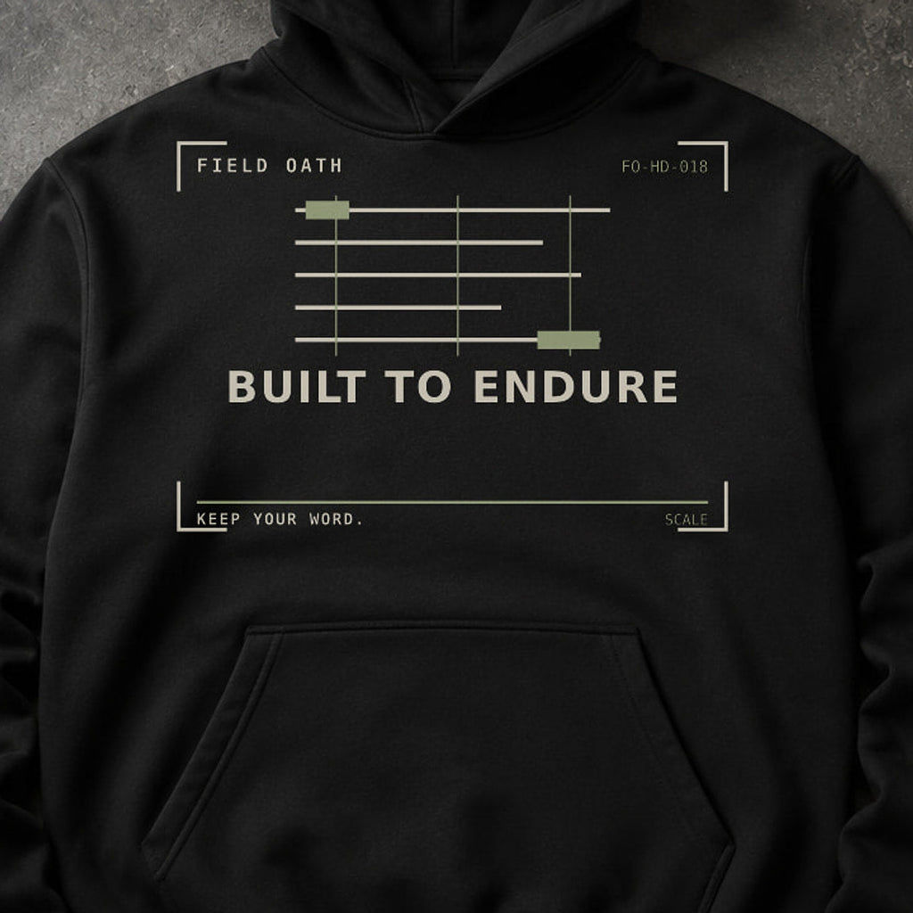 FIELD OATH Built to Endure Hoodie close-up of original tactical artwork and fabric texture