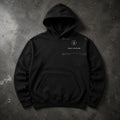 FIELD OATH Cold Latitude Hoodie black hoodie front artwork on dark concrete