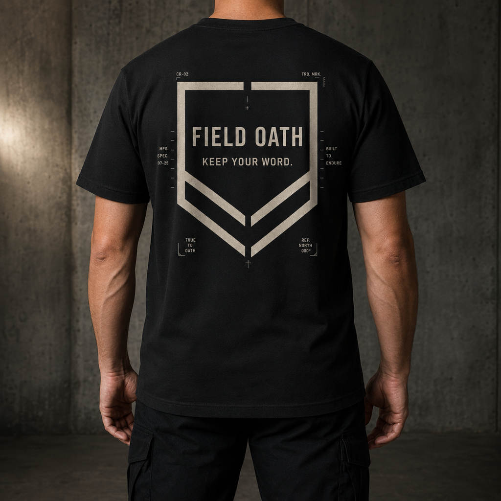 Black FIELD OATH Crest Line T-Shirt worn from the back with tactical trousers and no visible face