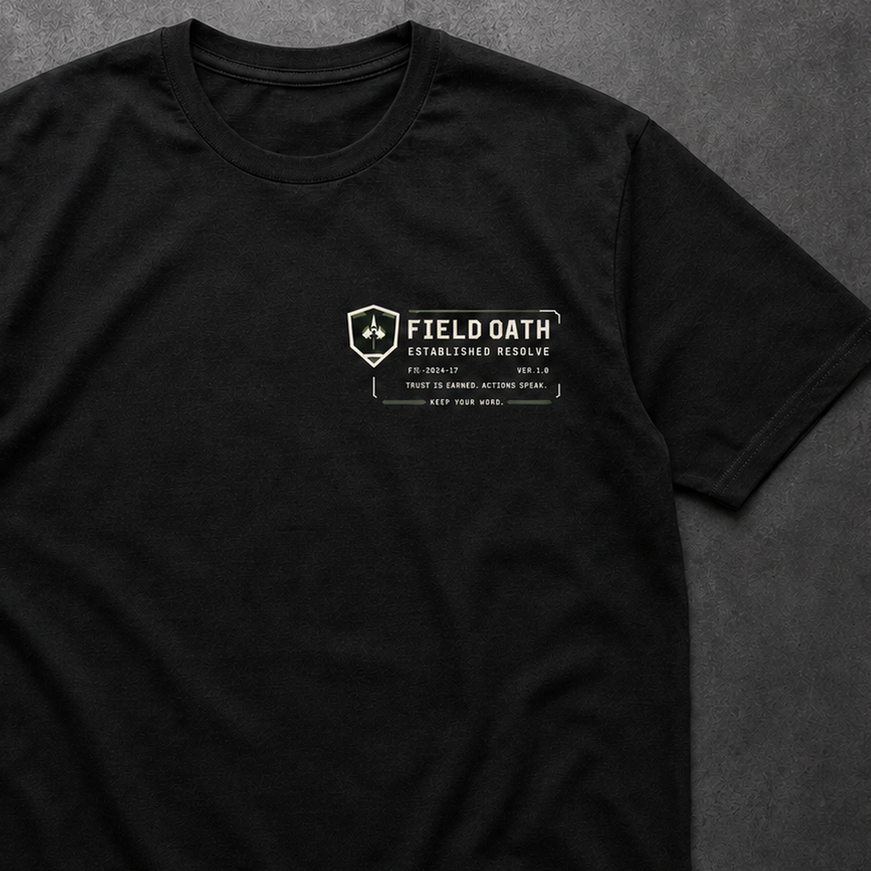 Close-up of FIELD OATH Established Resolve T-Shirt left-chest identifier and technical print