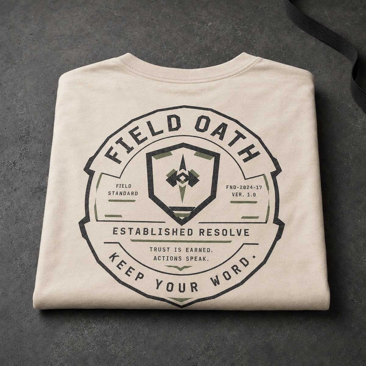 Bone FIELD OATH Established Resolve T-Shirt folded with large back equipment seal