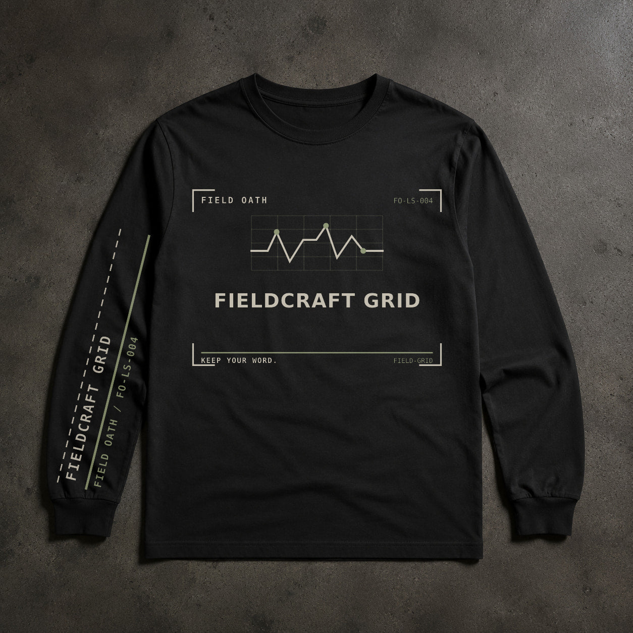 FIELD OATH Fieldcraft Grid Long Sleeve black long sleeve front artwork on dark concrete