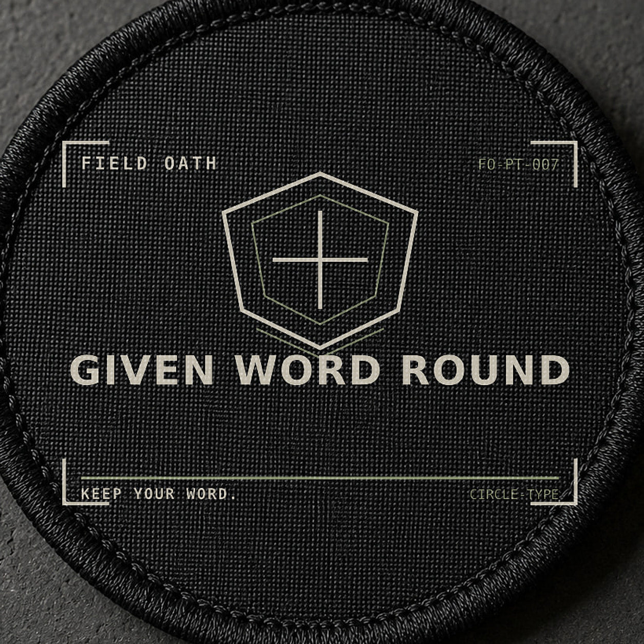FIELD OATH Given Word Round Patch close-up showing woven face, stitched border and embroidery detail