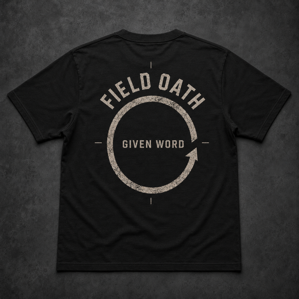Black FIELD OATH Given Word T-Shirt back flat lay with incomplete commitment ring graphic