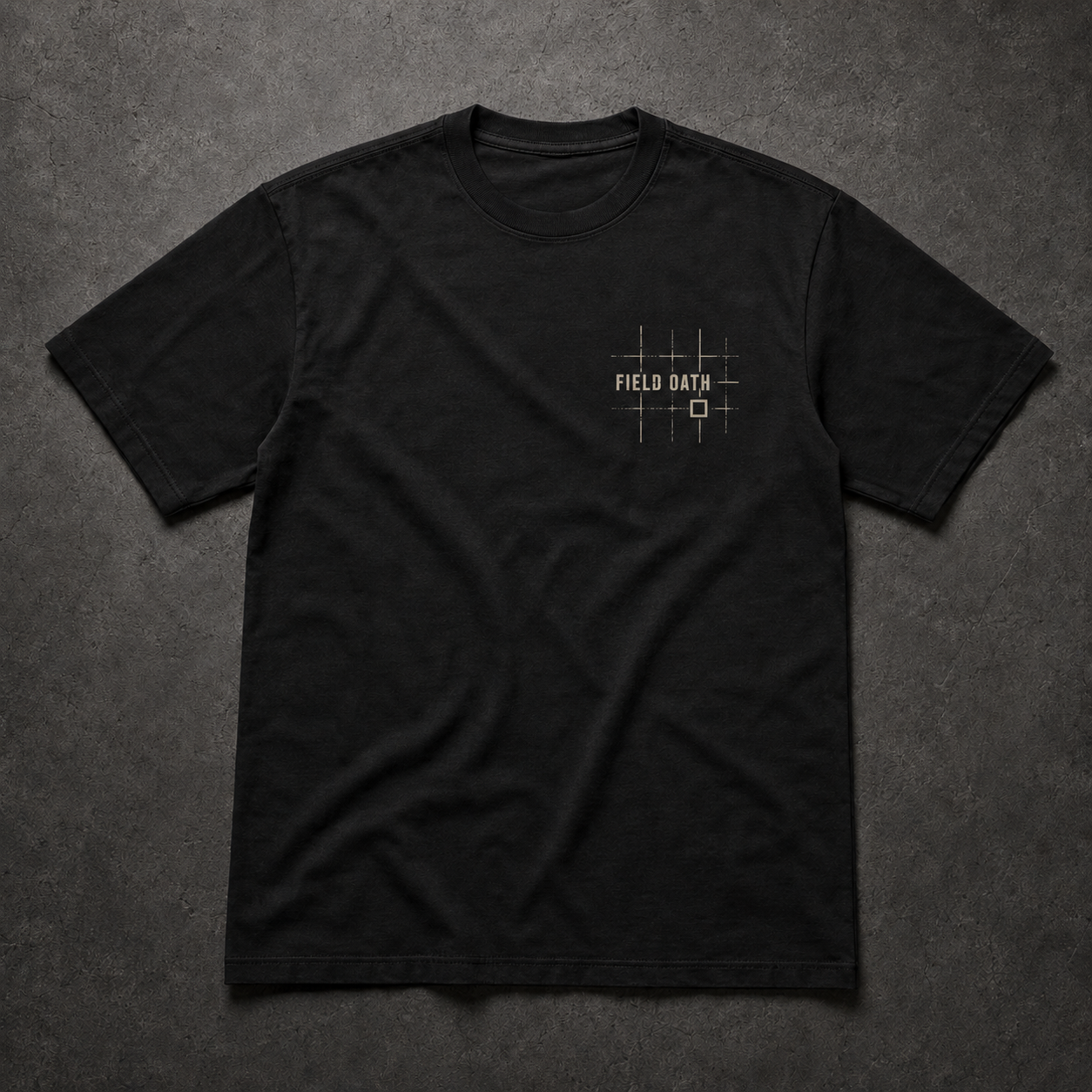 Black FIELD OATH Grid Reference T-Shirt front flat lay with compact navigation-grid chest identifier