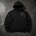 FIELD OATH Integrity in Action Hoodie black hoodie front artwork on dark concrete