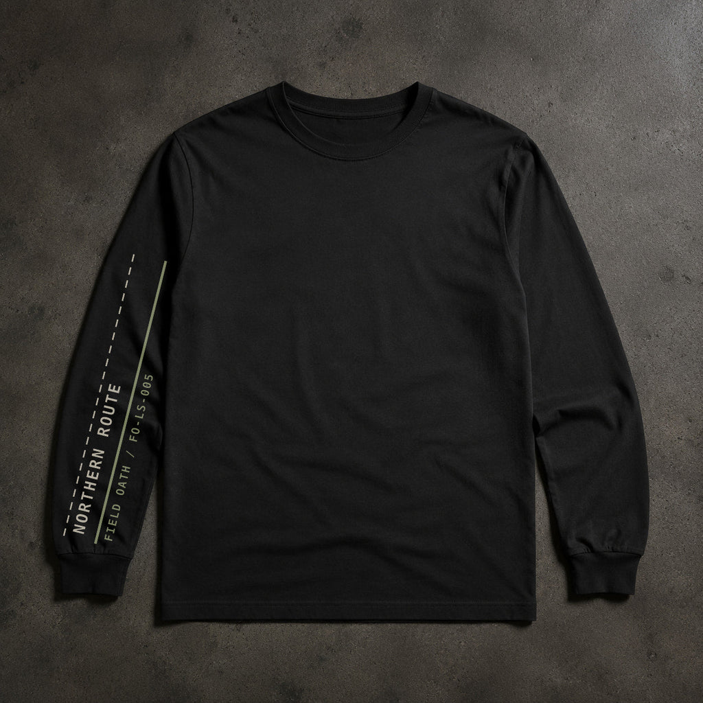 FIELD OATH Northern Route Long Sleeve black long sleeve sleeve artwork on dark concrete