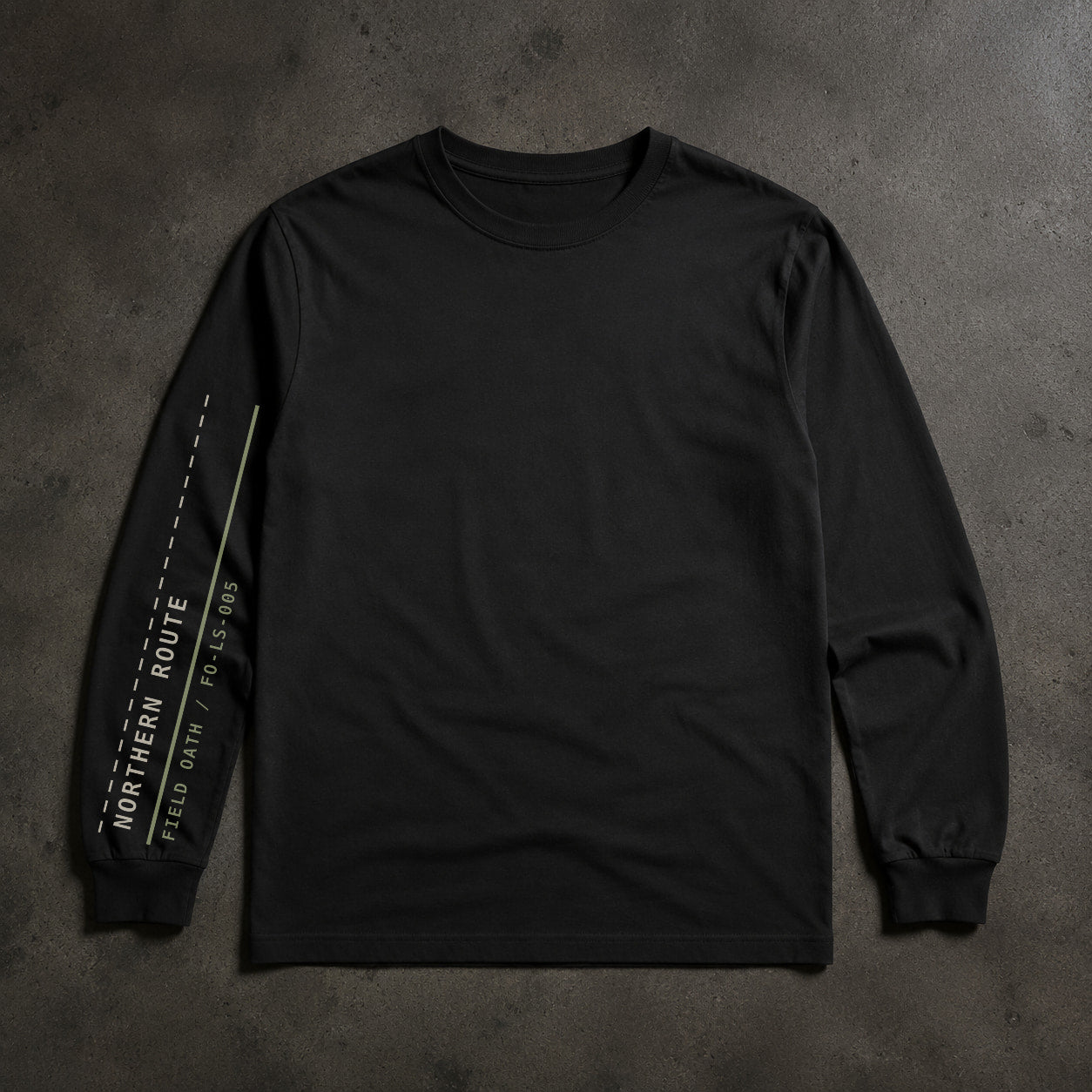 FIELD OATH Northern Route Long Sleeve black long sleeve sleeve artwork on dark concrete