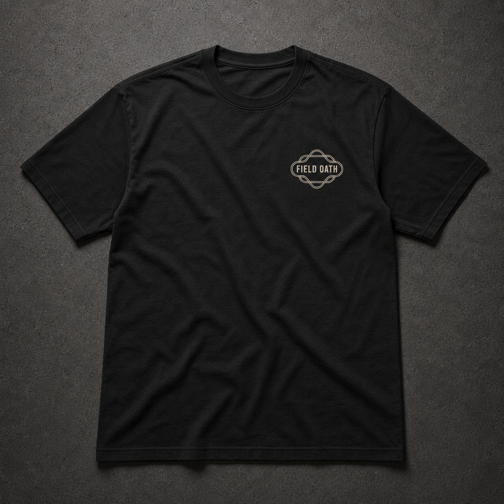 Black FIELD OATH Promise Held T-Shirt front flat lay with binding-line chest identifier