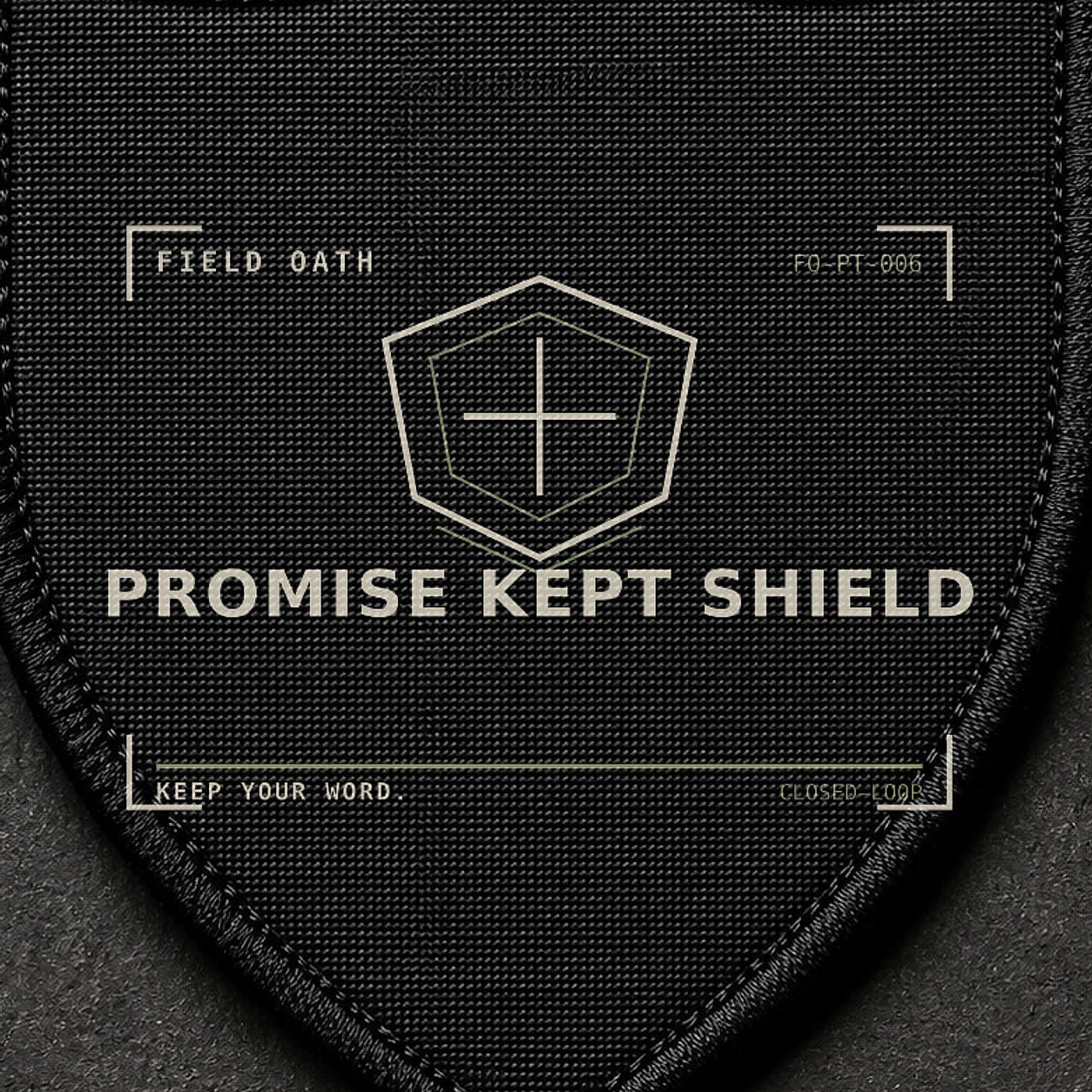 FIELD OATH Promise Kept Shield Patch close-up showing woven face, stitched border and embroidery detail