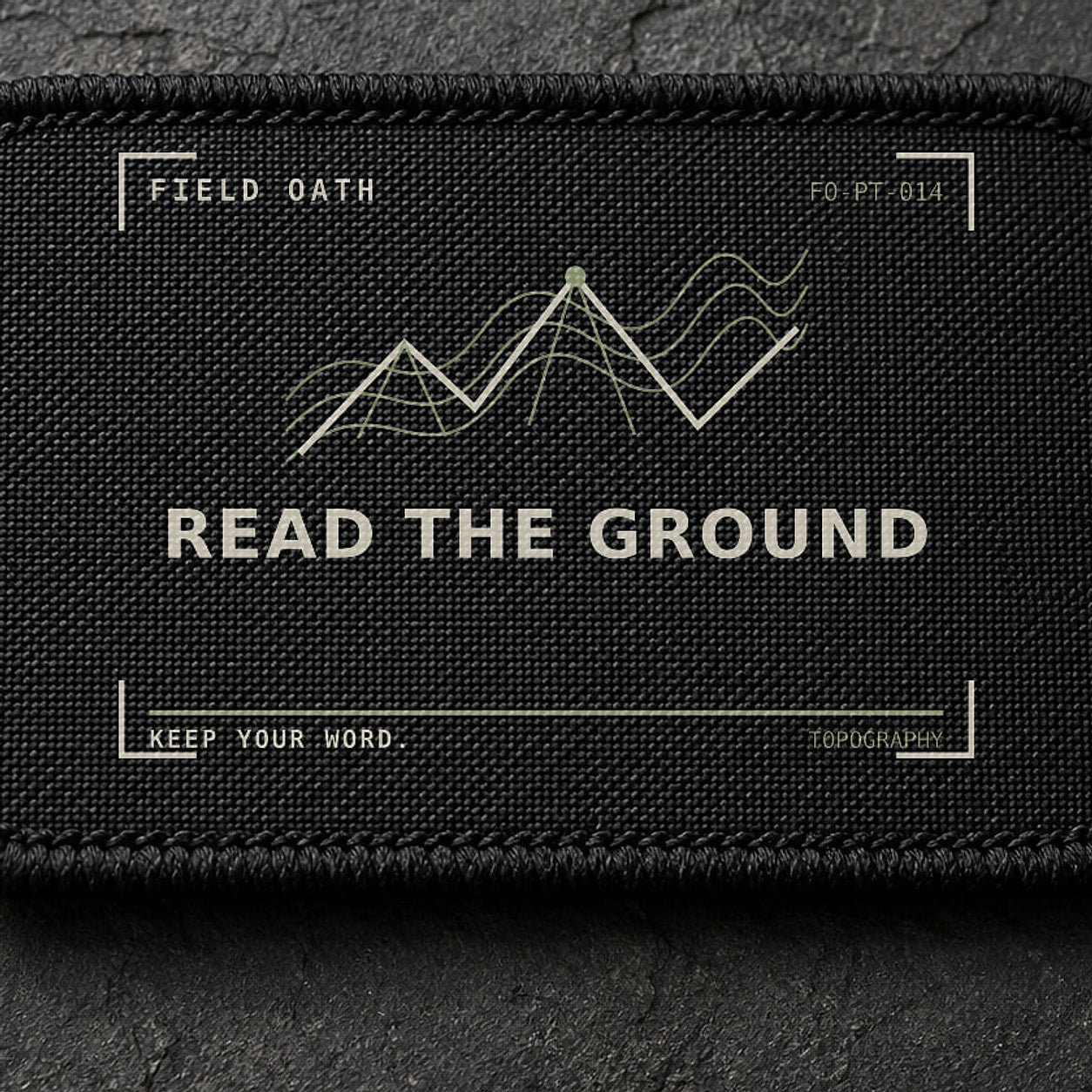 FIELD OATH Read the Ground Patch close-up showing woven face, stitched border and embroidery detail