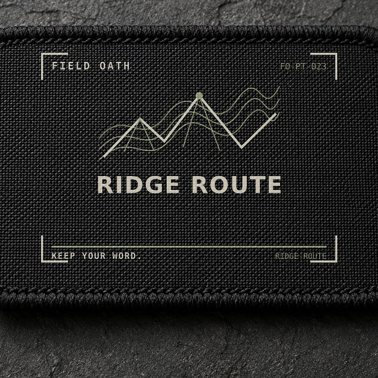 FIELD OATH Ridge Route Patch close-up showing woven face, stitched border and embroidery detail