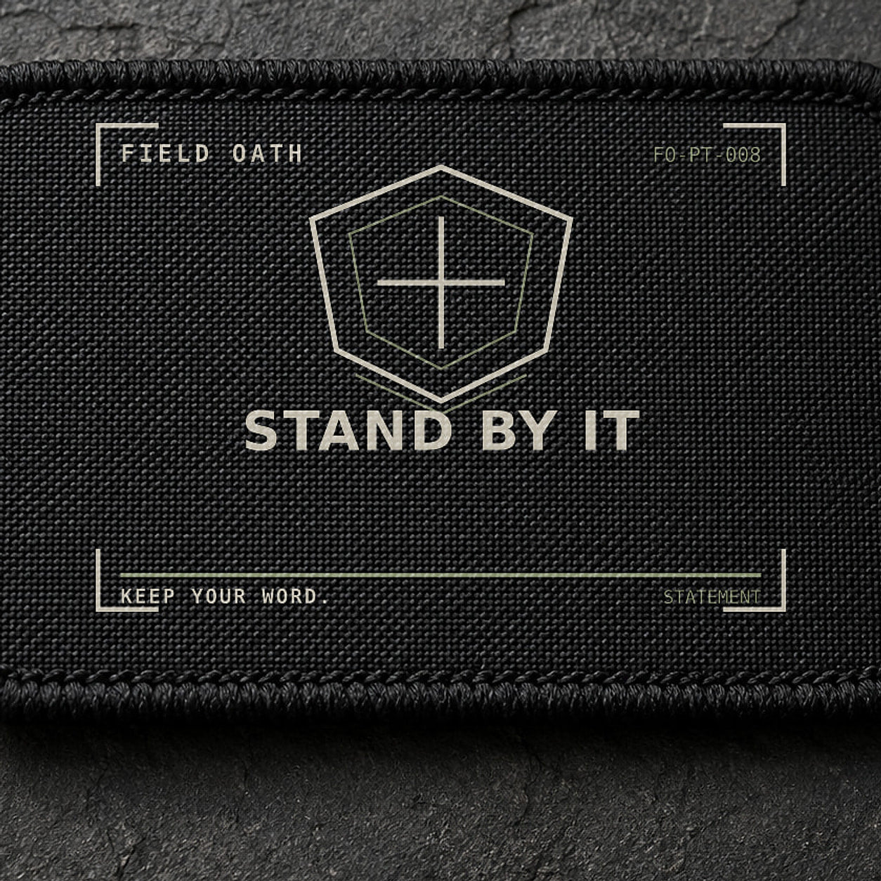 FIELD OATH Stand By It Patch close-up showing woven face, stitched border and embroidery detail