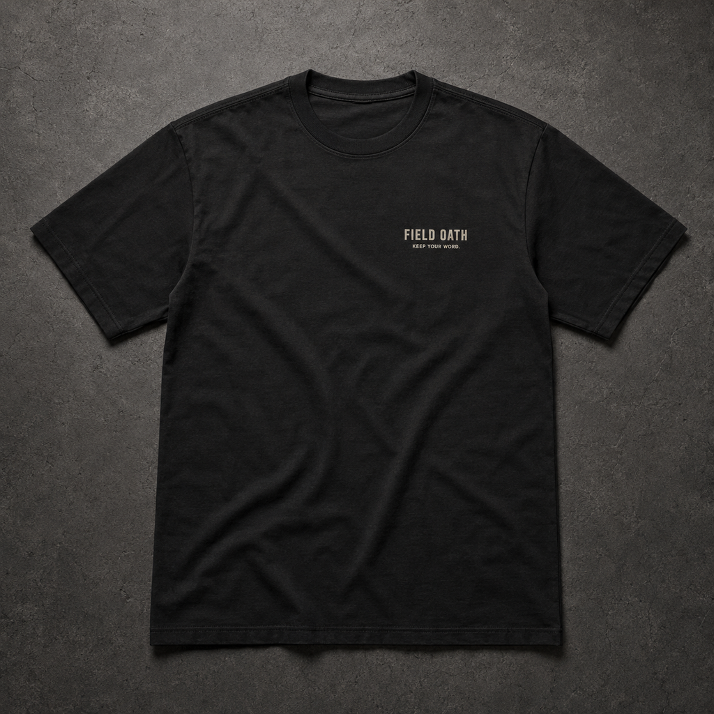 FIELD OATH Standard Mark T-Shirt front view in black with FIELD OATH chest identifier