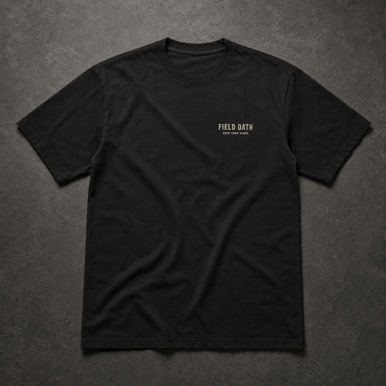 FIELD OATH Standard Mark T-Shirt front view in black with FIELD OATH chest identifier
