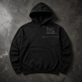 FIELD OATH Steady Hands Hoodie black hoodie front artwork on dark concrete