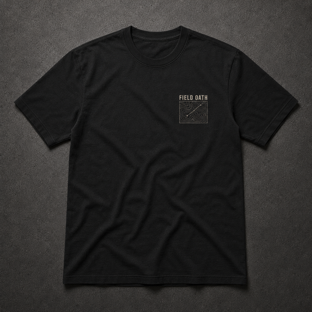 Black FIELD OATH Terrain First T-Shirt front flat lay with topographic chest identifier