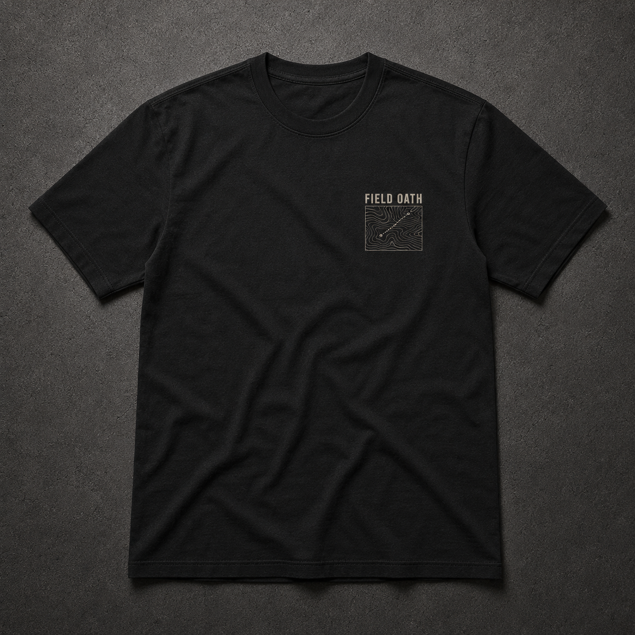 Black FIELD OATH Terrain First T-Shirt front flat lay with topographic chest identifier
