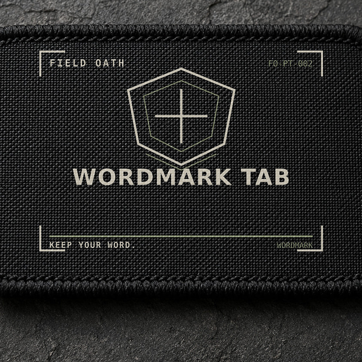 FIELD OATH Wordmark Tab Patch close-up showing woven face, stitched border and embroidery detail