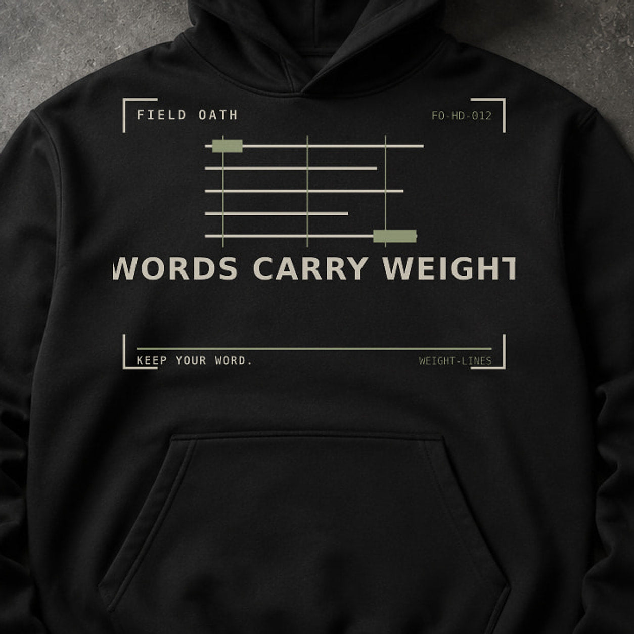 FIELD OATH Words Carry Weight Hoodie close-up of original tactical artwork and fabric texture