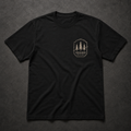 Black FIELD OATH Treeline North T-Shirt front flat lay with pine bearing left-chest artwork